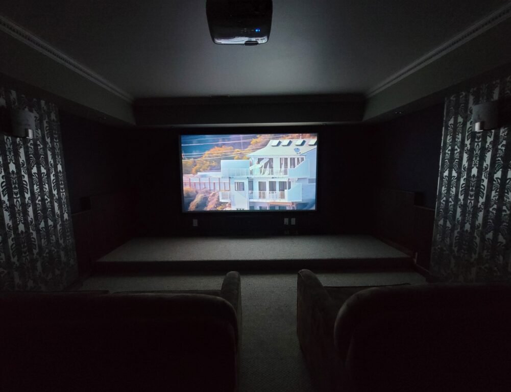 Custom Dark Room Home Theatre Cinema with Projector and Surround Sound by Mission Audio Visual in Kelowna